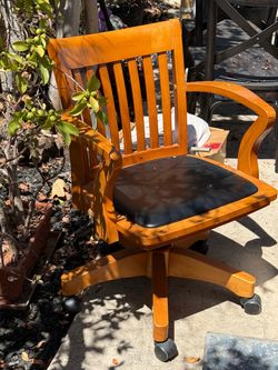 Solid wood and leather swiveling office chair