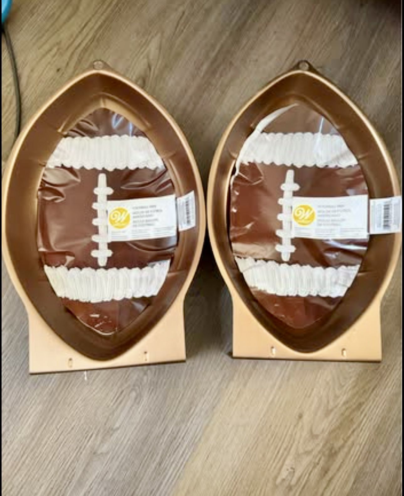 Wilton football shaped cake pans - $7 each brand new