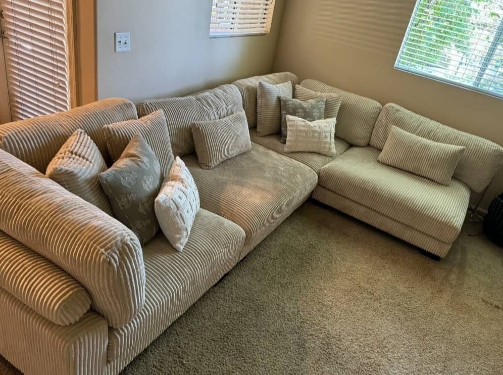 4-piece modular sectional.

Available in black, beige, and gray. Ask for price.