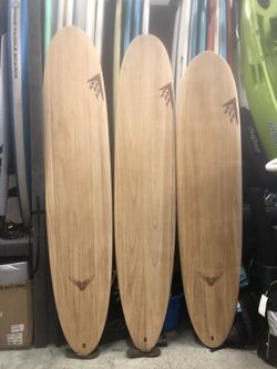 Firewire longboard surfboard with bag or fins for essential exercise