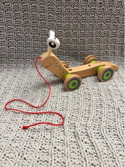 Wooden Hape baby snail walker toy