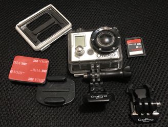 GoPro HERO with 8GB storage, waterproof protective case, new mounts, backdoor cover
