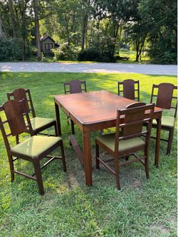 Vintage 1940s Art Deco waterfall style dining room set with six walnut chairs. And Matching Hutch