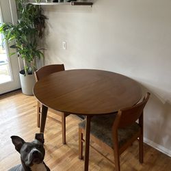 mid-century table with 3 matching chairs