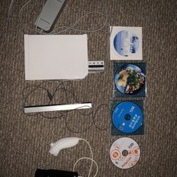 Nintendo Wii with 4 games