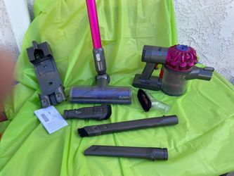 Dyson Vacume with all Attachments and Charger ( needs new battery)