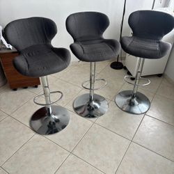 Three gray cloth  and chrome bar stools .. 32 “ at max .., swirl and up and down … $75 each