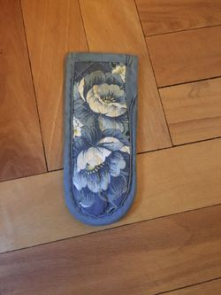 Padded pot handle holder