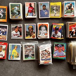 Baseball, American football, and basketball cards.