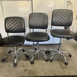 Set of 2 Adjustable Rolling Chairs – Faux Leather & Chrome Base
