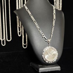Italian silver Figaro chain with silver centenario with Nugget bezel