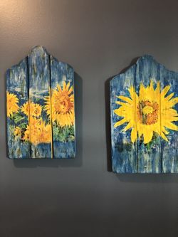 Handcrafted prints of sunflowers transfer with mod podge On a distressed wooden board