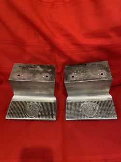 pair of CARR Work Truck Steps or underbody access steps made of polished or cast aluminum,