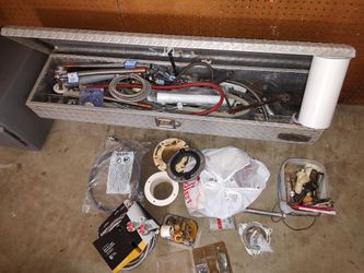 Toolbox full of plumbing parts