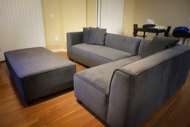 Dark Grey Sectional and Ottoman $949