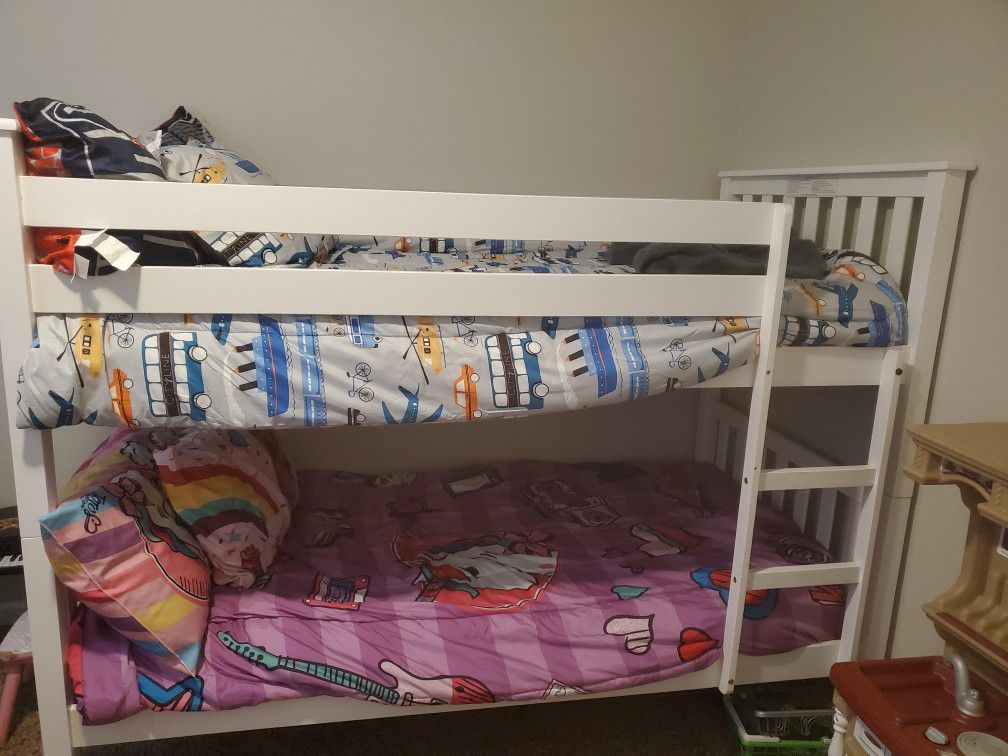White bunk bed with new mattresses