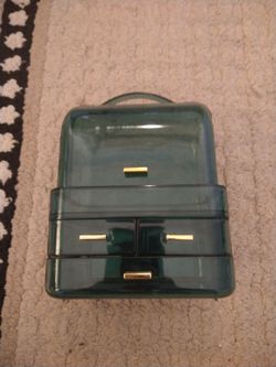 Small dark green tinted transparent acrylic makeup organizer