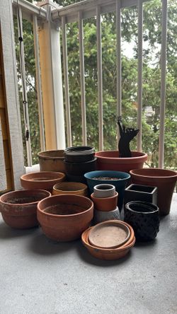 Variety of clay & plastic pots. Different sizes