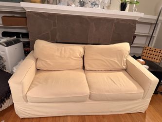 Cream Two-Seat Slipcovered Sofa