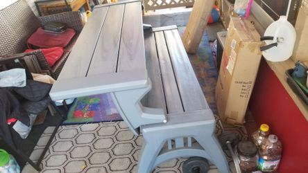 Foldable table with bench