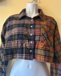 Cropped plaid flannel shirt with a multicolored patch design, size M (teens).