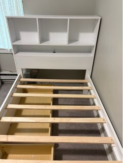 twin-size wooden platform bed in excellent condition.