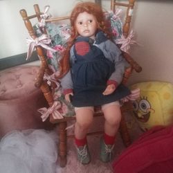 Porcelain Doll With Rocking Chair