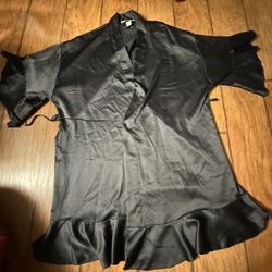 Victoria's Secret black satin short robe features flared sleeves and a front tie belt Xs on tag In very good condition