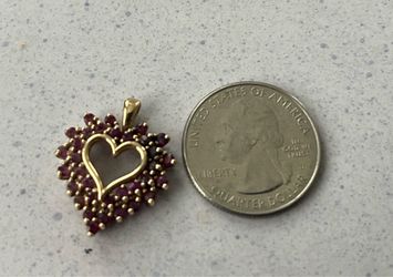 Heart 10 carat gold and ruby pendant one of