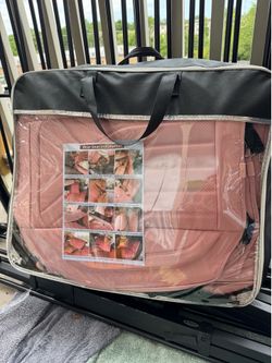 Set of pink car accessories: seat covers, steering wheel covers