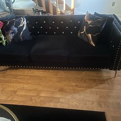 Black sofa and loveseat