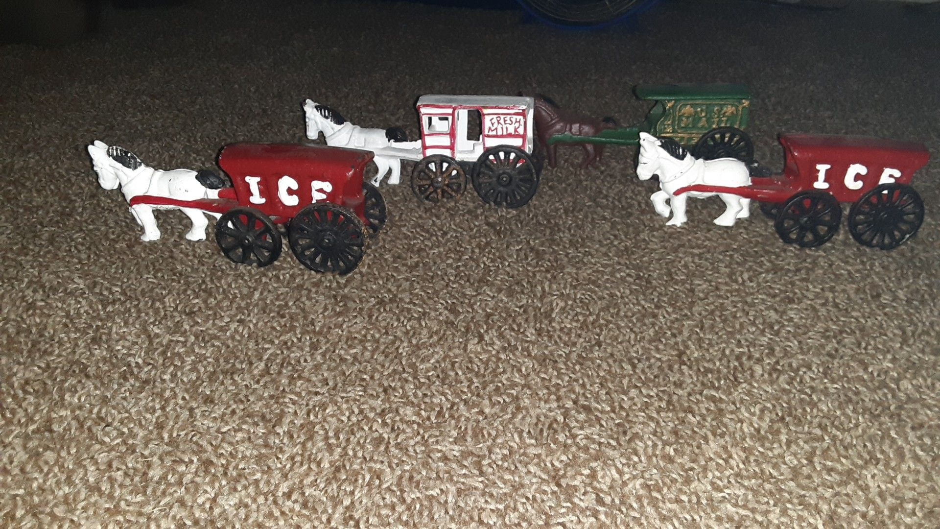 Cast iron porcelain buggie one mail , 2 ice buggies, fresh milk