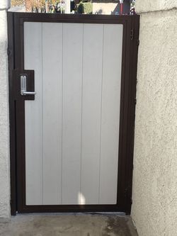 Metal gate with key pad lock