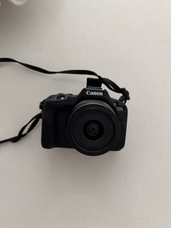 Canon R50 w/ 18-45 Lens.
