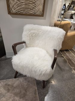 Brand New Pair of Mid Century Modern Kora faux shearling accent chairs finished in walnut