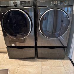 Samsung Front Load Washer & Dryer Set – Black Stainless + Pedestals