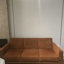 Rust orange sleeper couch