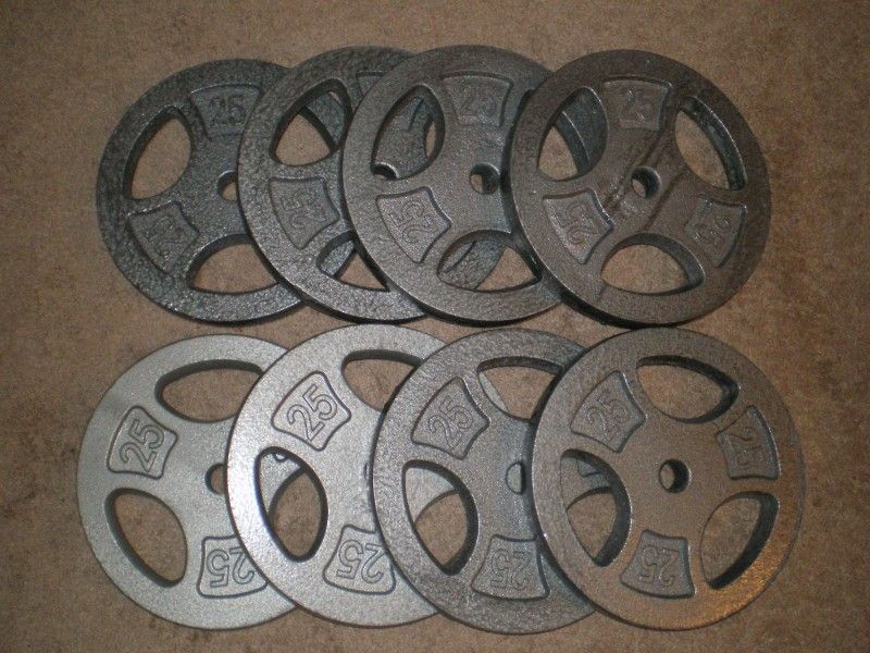 Weights 200lbs. 8 25 lbs plates New Condition. Fit 1" bar