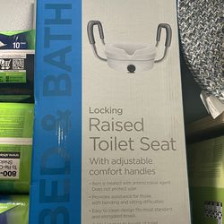 Raised toilet seat