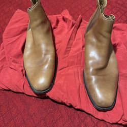 This is a pair of tan leather ALDO men's Chelsea boots