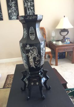 4 art floral panels, 2 oyster polish ebony varnished vases with stands