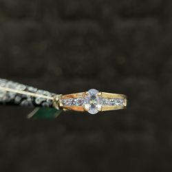 10K GOLD RING, WITH AQUAMARINE STONES 