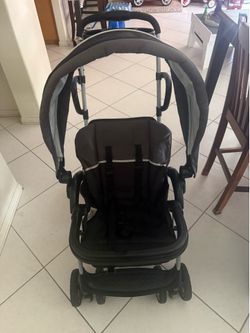 Stroller for two, one in cart & other behind seat