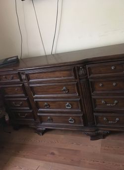 Raymour and Flanigan Dresser with beautiful mirror. Has some missing knobs otherwise in good condition. Very sturdy