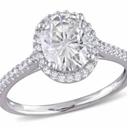 Moissanite and Diamond engagement ring in 14k white gold.