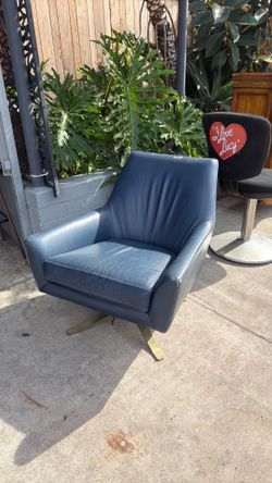 Mid Century leather swivel chair