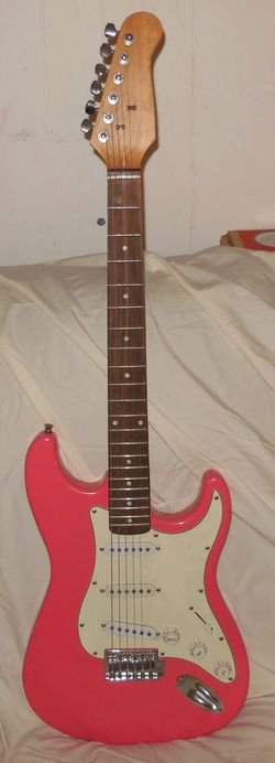 Pink electric guitar unbranded