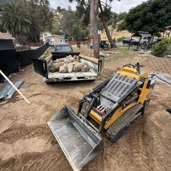 Skid Steer Work Grading Concrete Demo Dirt