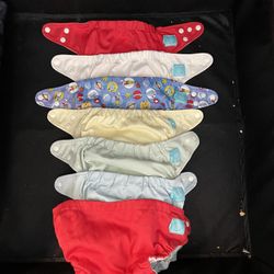 Charlie banana Clothe Diapers  7 clothe diapers - may need elastic replacement  22 extra reusable inserts  Lots of baby items available and not posted
