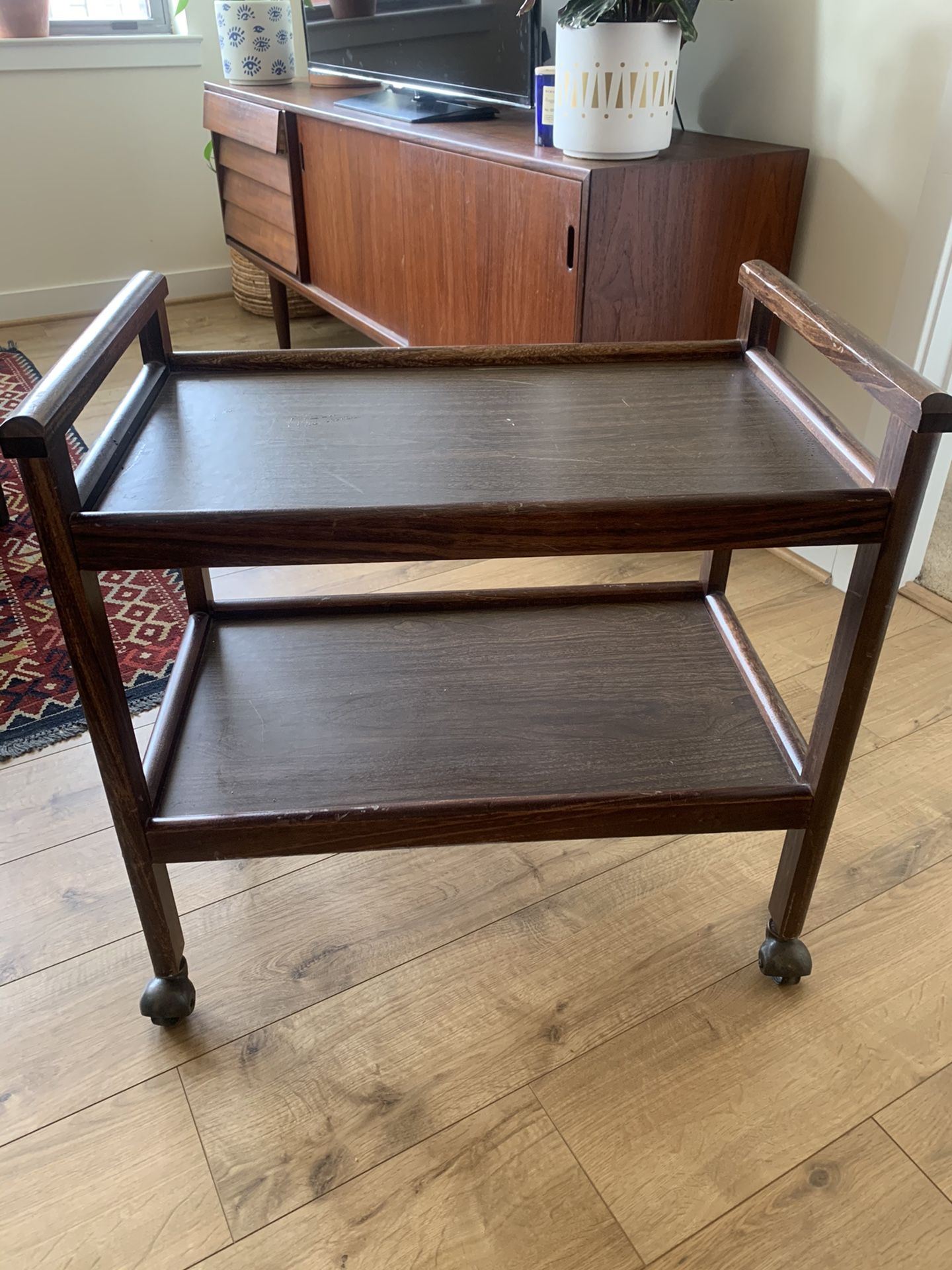 Midcentury bar or tea cart. I used as a bookcase. Lightweight and is in fair condition but super cute.